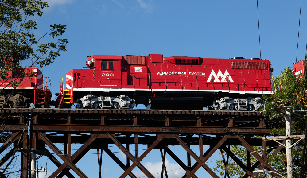 Freshly painted red and white diesel on bridge