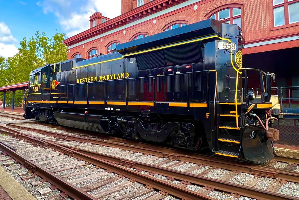 Black locomotive with Western Maryland Railroad logos and lettering