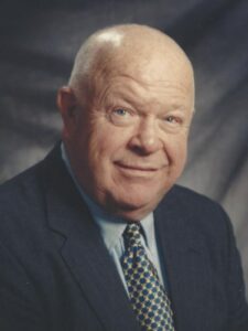 Headshot of man in suit