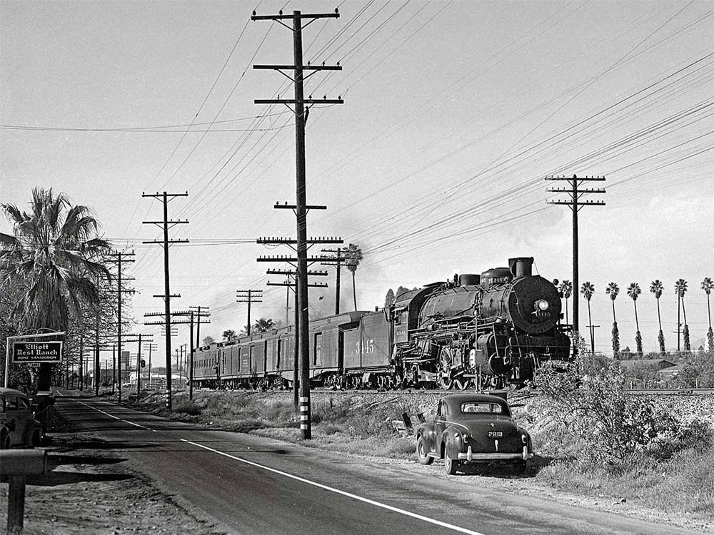 Black and white photo of steam-powered passenger train