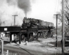 Central of Georgia steam locomotive on bridge in city