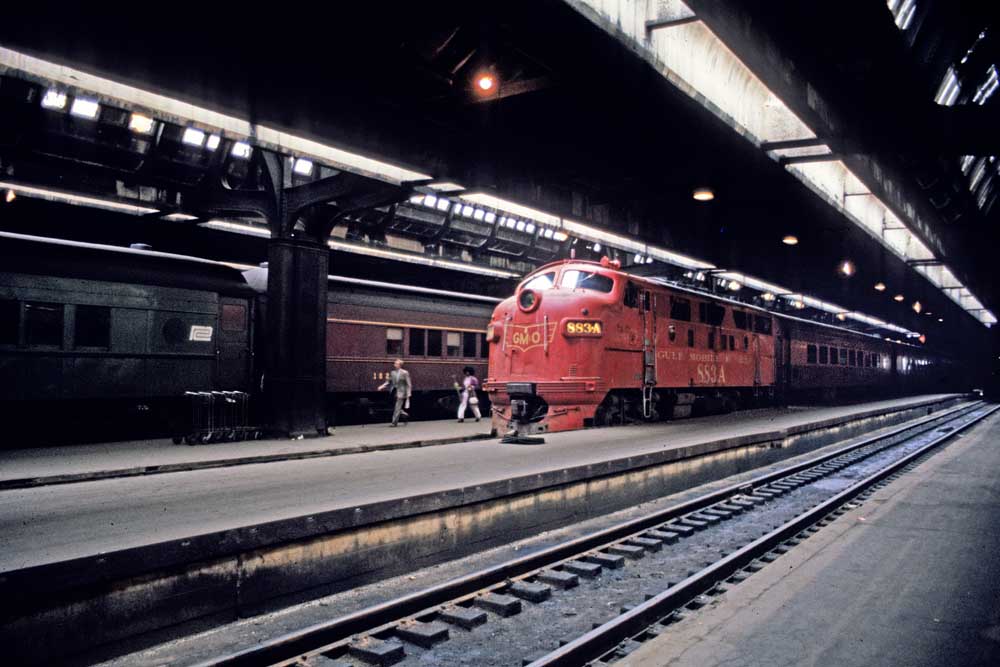Passenger train in station under train shed