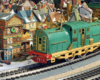 tinplate engine near holiday buildings on layout