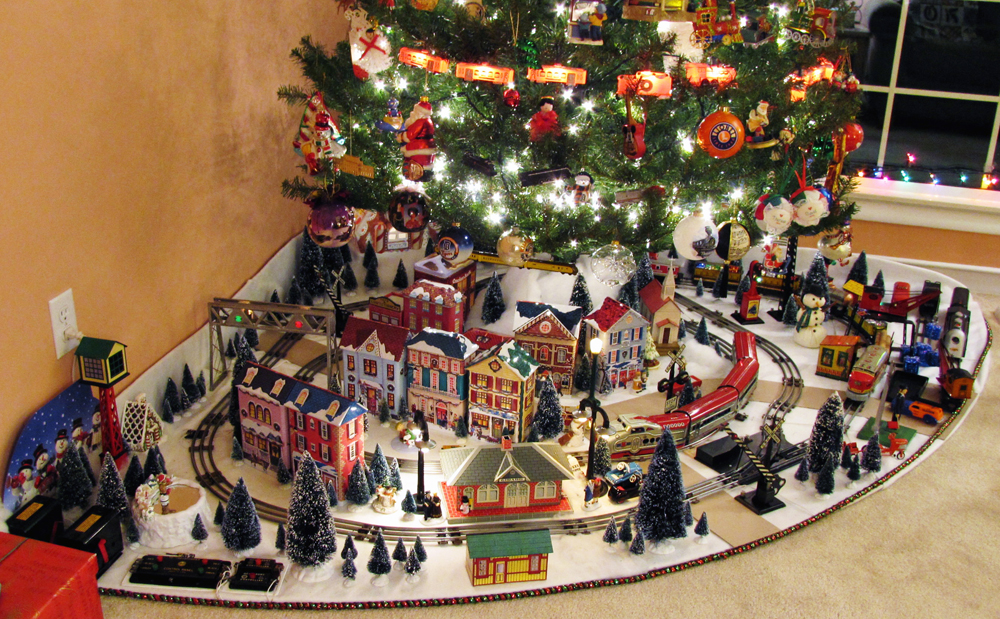 Christmas tree with train layout underneath it