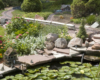 model locomotive on garden railway with a pond nearby