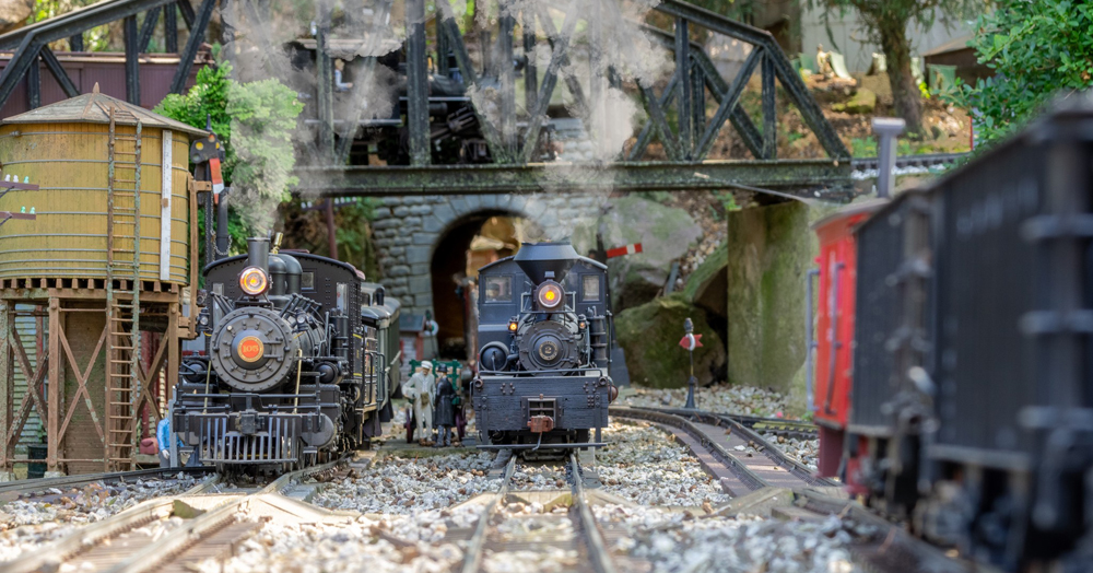 Meet Randy Mower: two model steam engines on track