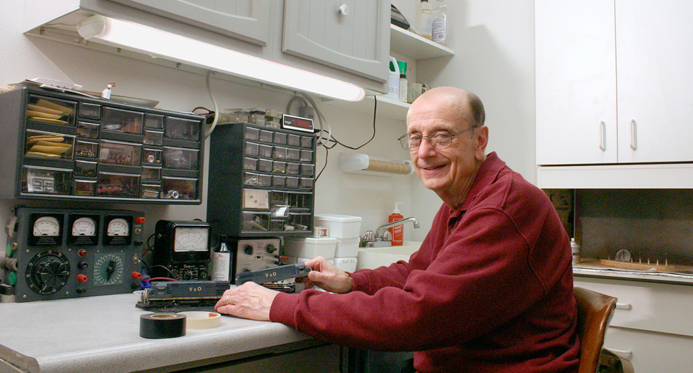 Photo of man at workbench