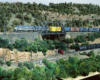 Photo of a train passing over a bridge with rocky outcroppings above and below