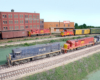 Photo of three HO scale trains passing each other