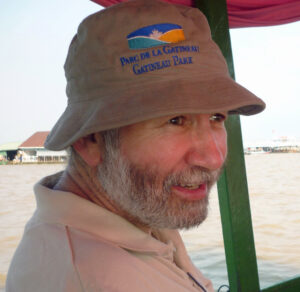 Photo of man with beard and hat on boat