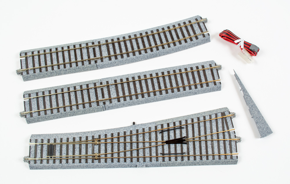 Photo of HO scale turnout with molded roadbed and accessories