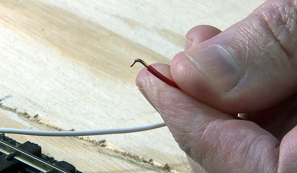 A 90 degree bend being made in the wire.
