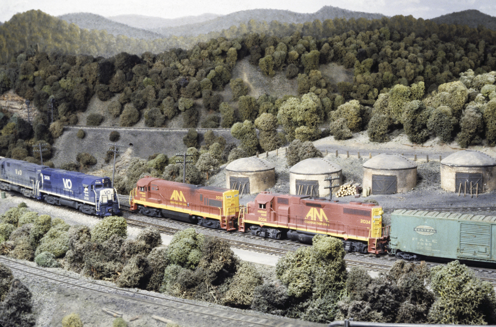 Photo of two trains passing on HO scale layout
