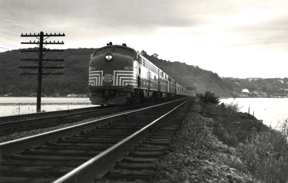 black and white train on tracks