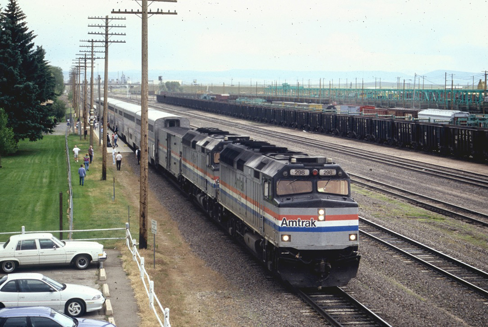 Passenger train stopped at station, as viewed from high angle