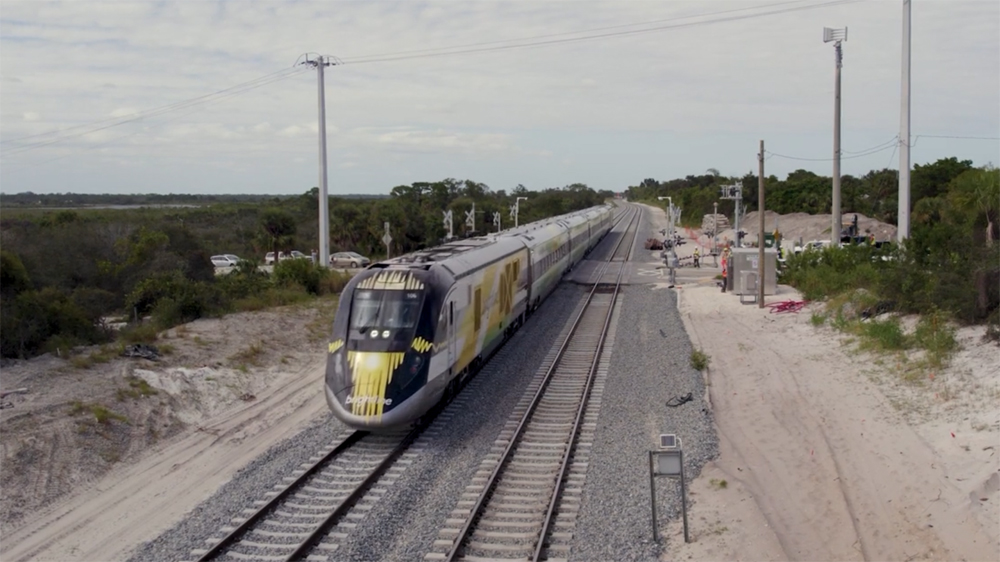 Front view of streamlined passenger train on double track