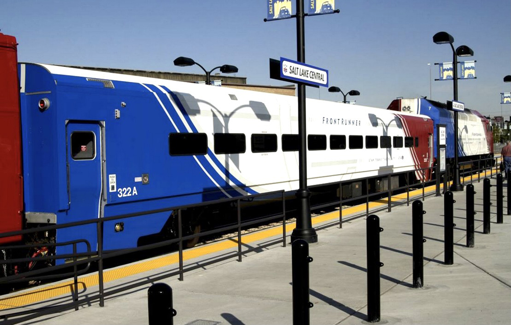 Red, white, and blue single-level commuter coach