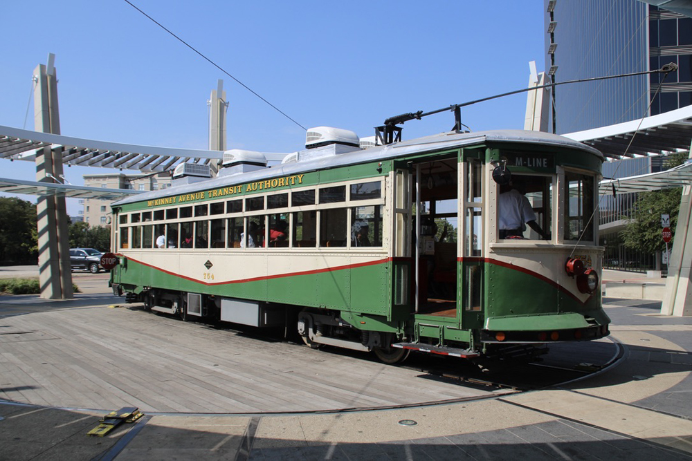 Trolley car with green and cream paint scheme on turntable