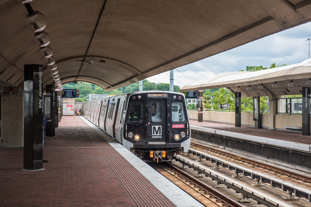 Rapid-transit train arrives at above-ground station