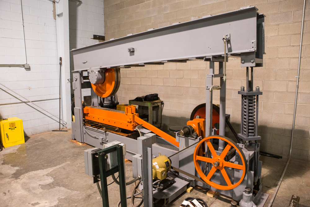 Graya and orange piece of machinery