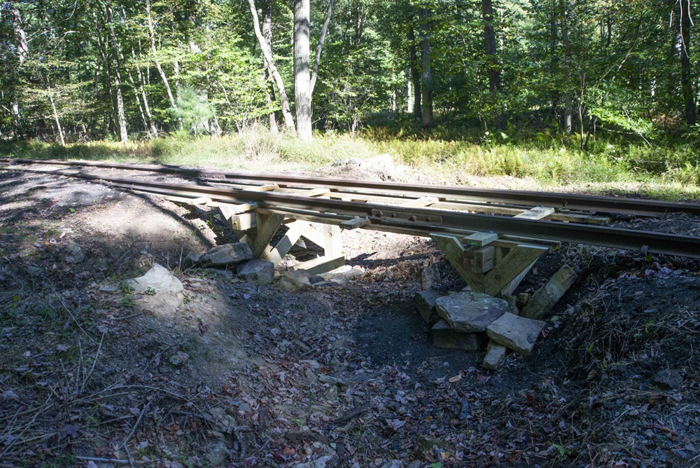Handbuilt timber bridge under rails that had been left unsuppored by washout
