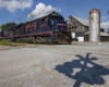 blue, red, and silver painted locomotive