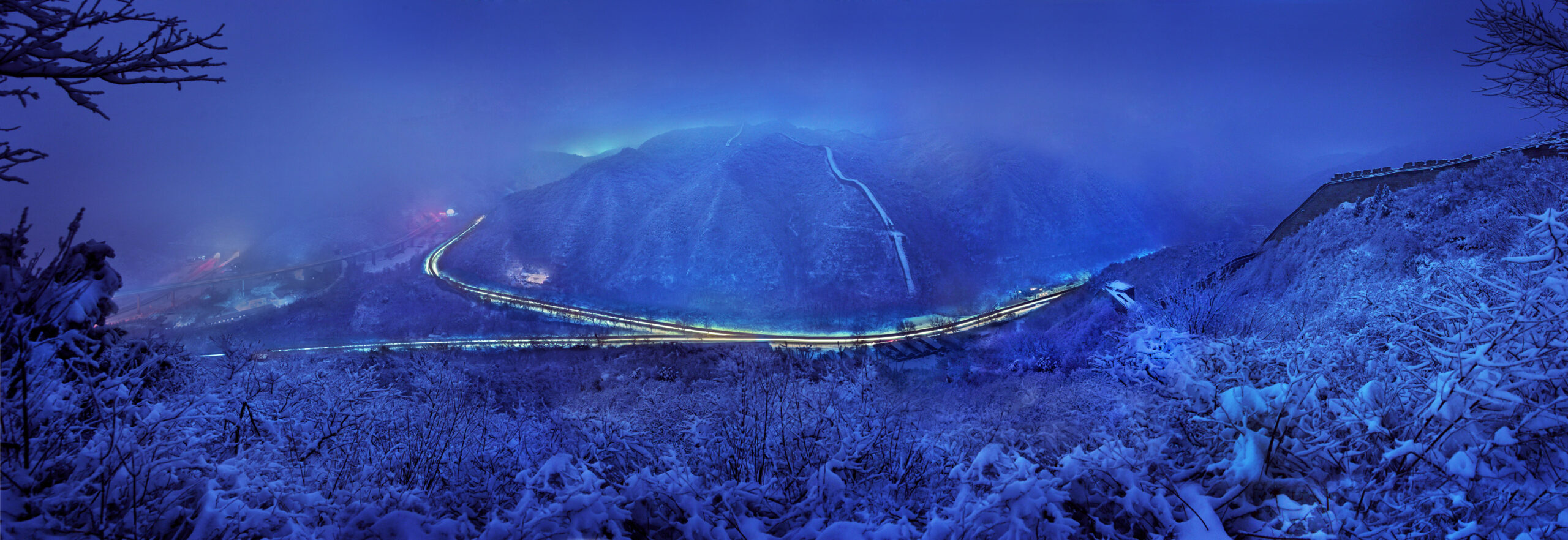 Tracks going through and around mountains at night