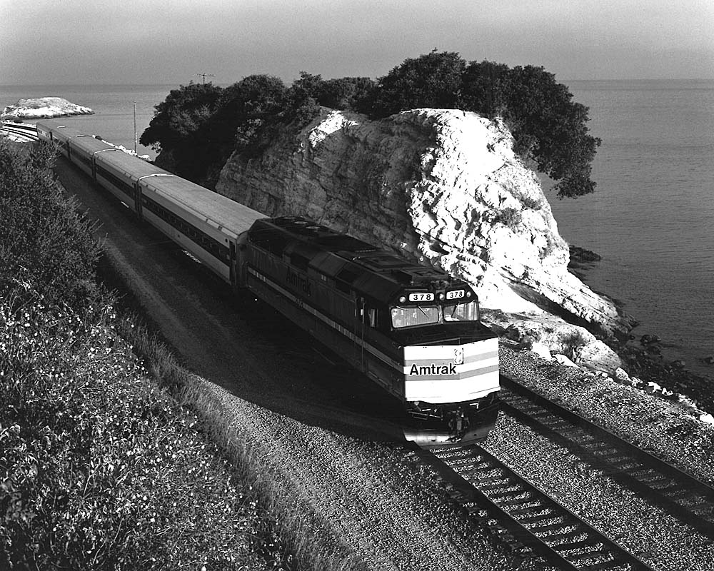 Amtrak San Diego service passenger train along ocean coastline