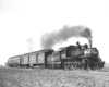 Steam Missouri-Kansas-Texas locomotive with two-car passenger train
