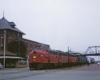 Red diesel Missouri-Kansas-Texas locomotive at passenger station