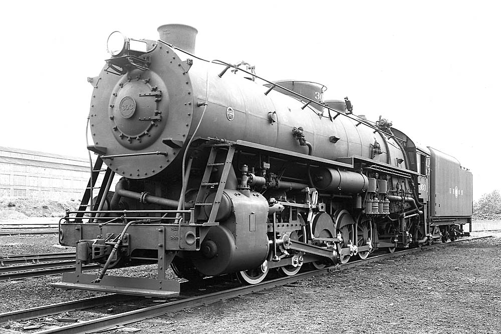 Three quarter view of front of biggest steam switcher locomotive in yard