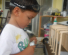 boy working with foam and craft sticks