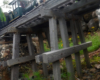 model steam engine crossing wood trestle