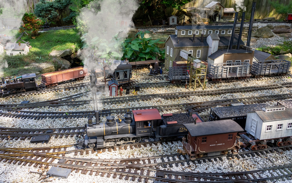scene on garden railway with engines and smoke