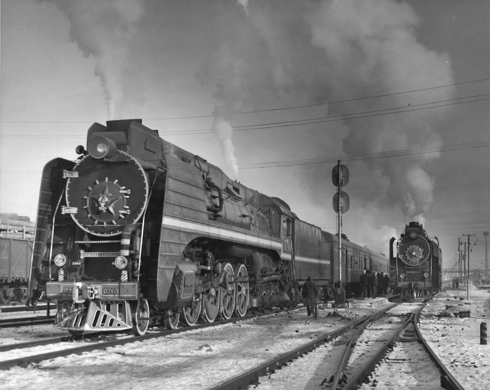 A black and white photo of Soviet steam locomotive
