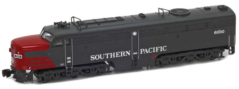 A gray locomotive with a scarlet front end