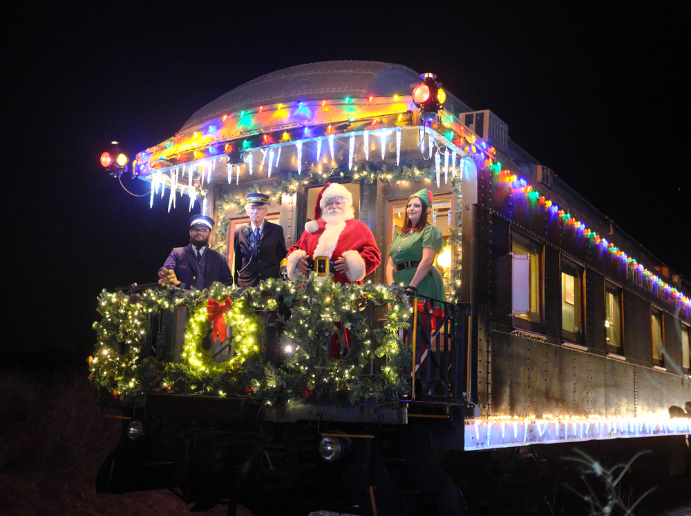 Santa on decorated observation car platform