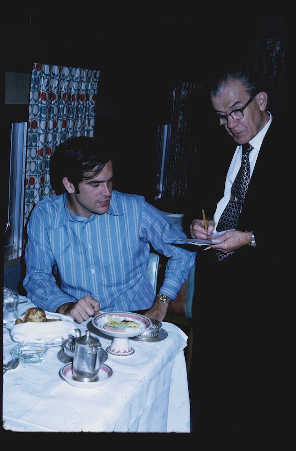1972 photograph of Bob Johnson and Amtrak dining car steward aboard the Super Chief
