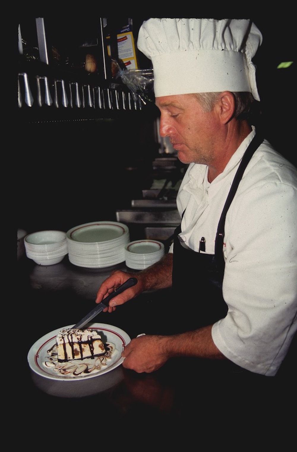 1999 photograph of an Amtrak chef at work in a dining car