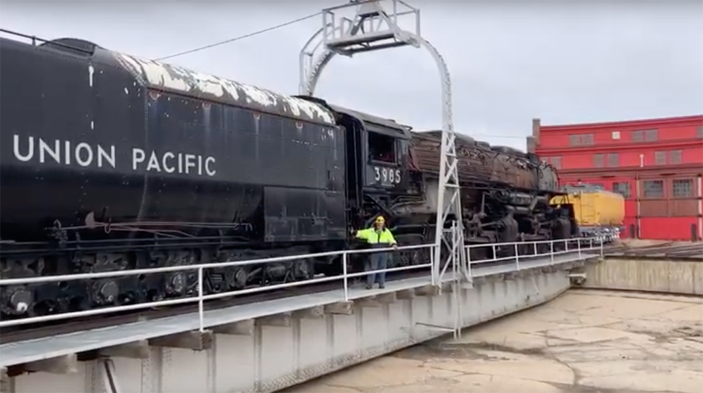 Black steam locomotive on turntable