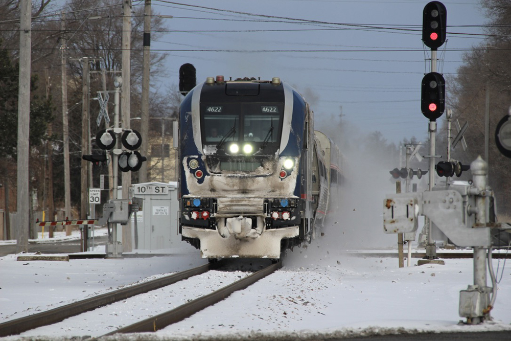 Diesel with front caked with snow crosses diamond