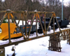 model steam locomotive plows on trestle