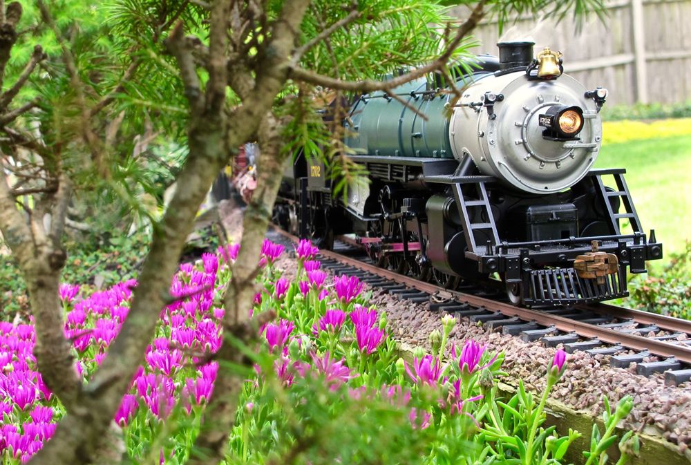 Trailing ice plant next to model locomotive