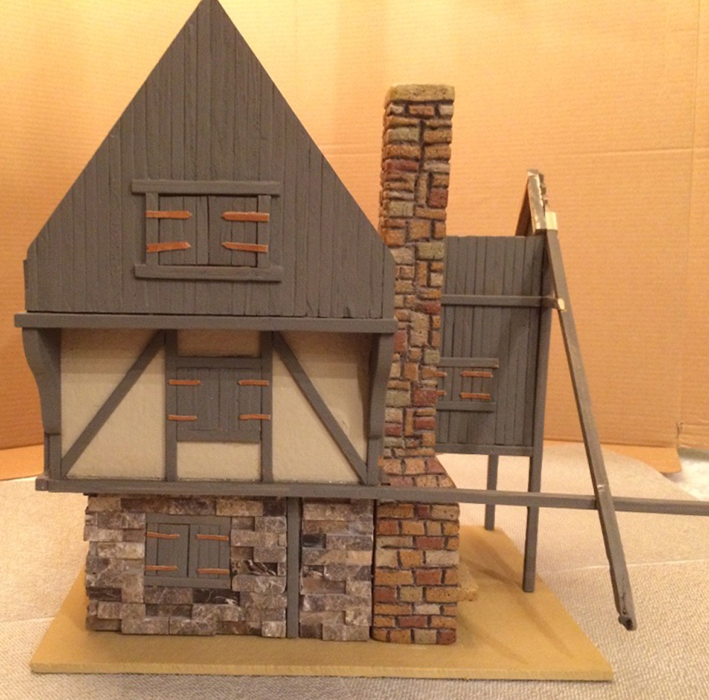 wood overhang on model cottage