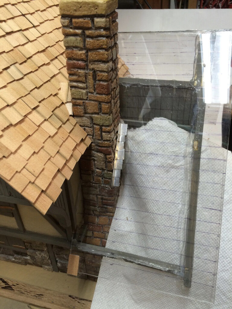 lines drawn on model cottage roof