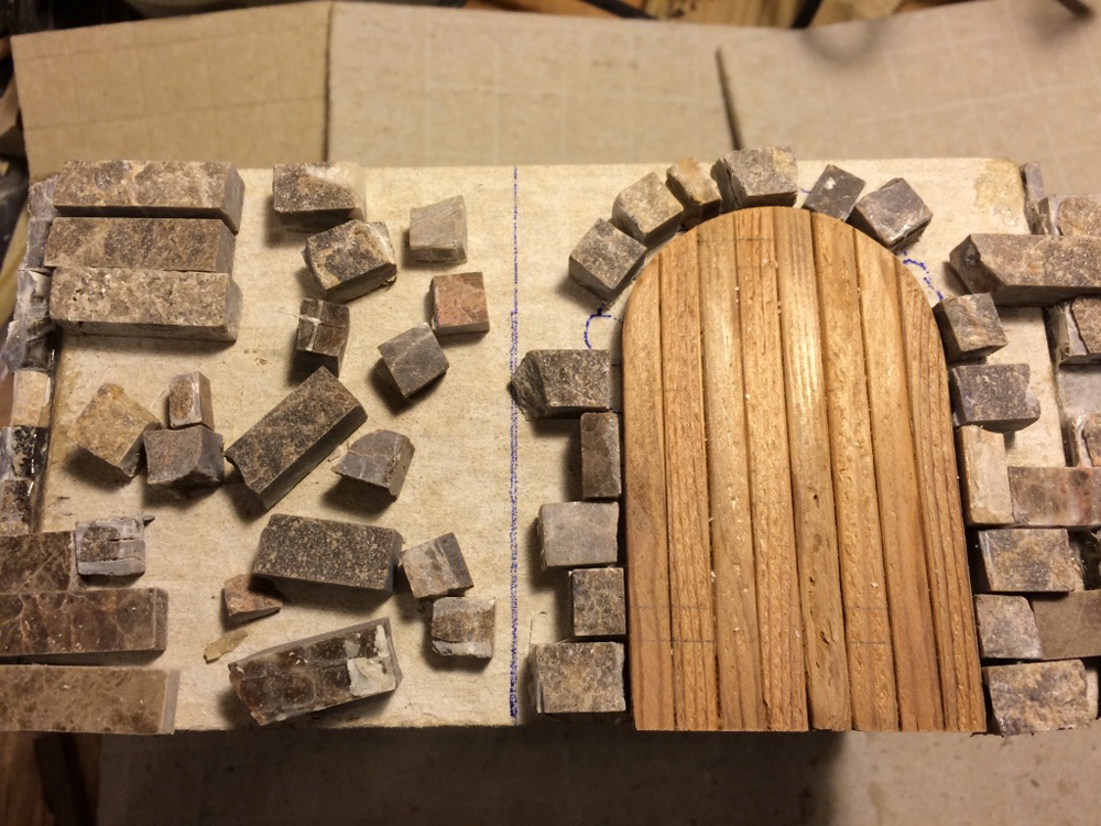 small stones around a wood door
