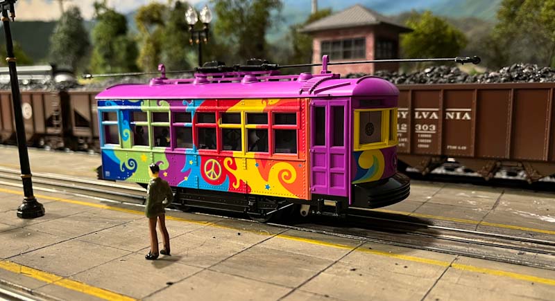 Lionel Trippy Trolley on statioon platform with passenger