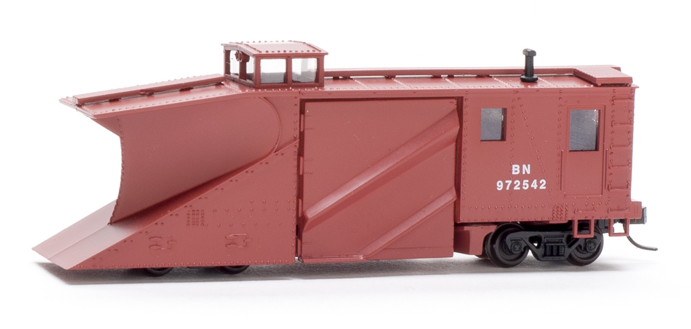 Photo of N scale Russell snowplow painted Oxide Red on white background