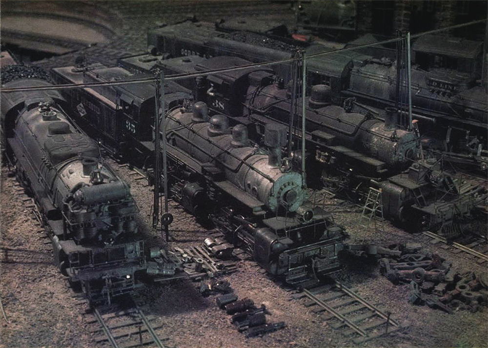 Model Steam Locomotives parked at on tracks near a turntable