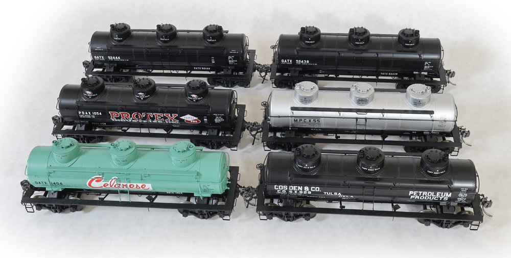 Group photo of six O scale tank cars